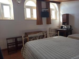 Tempat tidur dalam kamar di Torretta ai Sassi