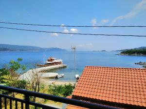 a view of a boat in a body of water at Gianni's Apartment By The Sea in Ammouliani