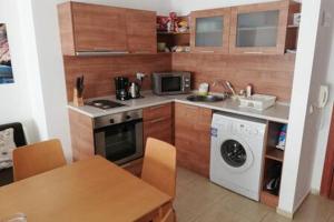 a kitchen with a sink and a stove and a dishwasher at Yves 2 Bed apart at Sun Village Sunny Beach not far away from the sea in Sunny Beach