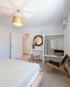 A bed or beds in a room at Phoenicia Naxos