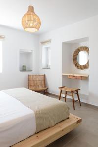 A bed or beds in a room at Phoenicia Naxos
