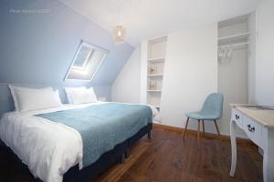 Postel nebo postele na pokoji v ubytování B&B Maison Ruthier
