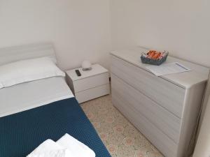 A bed or beds in a room at B&B IONIO