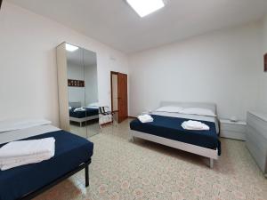 A bed or beds in a room at B&B IONIO
