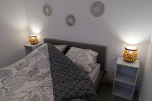 Postel nebo postele na pokoji v ubytování Clermont Centre- Appartement Privé