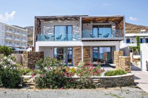 a villa with a view of the ocean at Seaside Tinos in Kionia