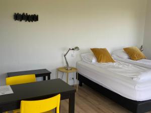 Postel nebo postele na pokoji v ubytování Brú Guesthouse