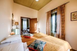 a bedroom with two beds and a window at Kristina´s Apartments in Rhodes Town