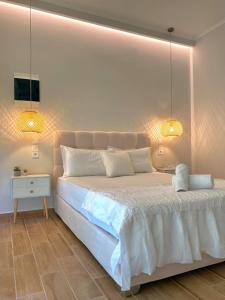 Llit o llits en una habitació de Elia Room & Garden