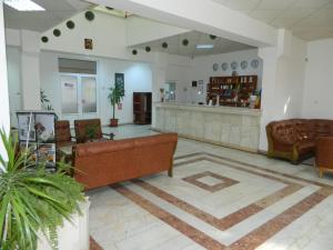 a lobby with couches and a counter at Motel Prietenia in Giurgiu