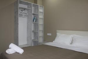Llit o llits en una habitació de Batumi Loves you Apartment
