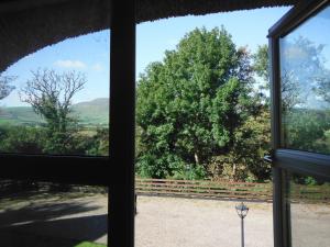 a view from the window of a house at Inspiration Lodge in Anascaul