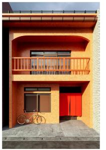 a bike parked on the side of a building at Momiji Takayama in Takayama