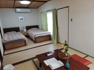 Postel nebo postele na pokoji v ubytování Hotel Otani