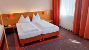 Postel nebo postele na pokoji v ubytování Hotel Fabrik Wien