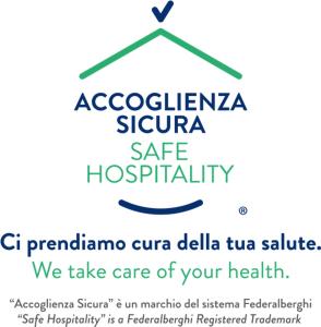 a sign that reads acociacionigma sigma safe hospitalify at Hotel del Centro in Palermo