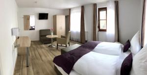 Postel nebo postele na pokoji v ubytování A Lotus Hotel