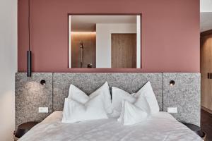 Ένα ή περισσότερα κρεβάτια σε δωμάτιο στο Haller Suites & Restaurant
