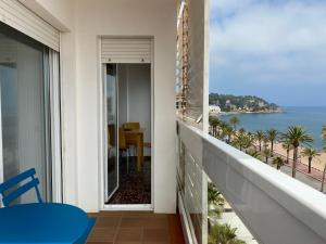a balcony with a view of the ocean at Mediterranean apartment in Lloret de Mar next to the Sea in Lloret de Mar