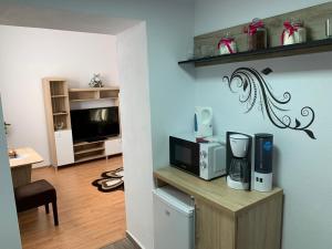 A television and/or entertainment centre at Vik. Apartment