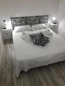 Postelja oz. postelje v sobi nastanitve Le Case Del Grillo