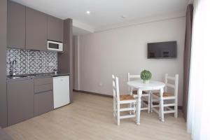 Kuchyň nebo kuchyňský kout v ubytování Apartamentos Ribera