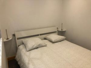 Katil atau katil-katil dalam bilik di Appartement avec jardin