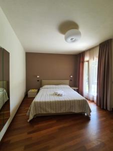 Katil atau katil-katil dalam bilik di Sirmione Rosselli Apartments