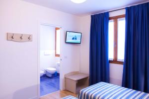 Postel nebo postele na pokoji v ubytování Agriturismo la Chiocciola