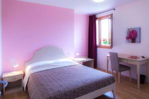 Postel nebo postele na pokoji v ubytování Agriturismo la Chiocciola
