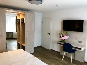 Μια τηλεόραση ή/και κέντρο ψυχαγωγίας στο Hotel Kranenborgh Steinhude am Meer