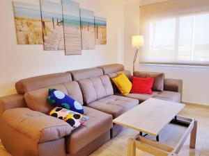 Posedenie v ubytovaní Apartamento con piscina en Oliva Nova