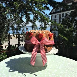 a chocolate cake with a bow on top of a table at Hotel Mozart in Rorschach