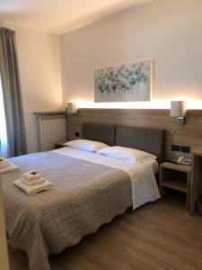 Posteľ alebo postele v izbe v ubytovaní Albergo Grobberio