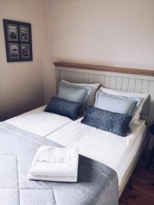 a bedroom with two beds with towels on them at Guest house ''8 Smilgos'' in Klaipėda