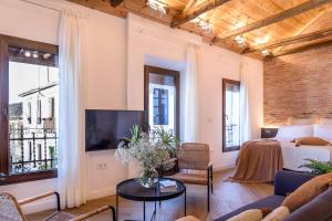 TV a/nebo společenská místnost v ubytování FERALA SUITES ALBAYZíN