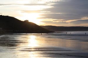 The sunrise or sunset as seen from the apartment or nearby 