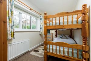 Ένα ή περισσότερα κρεβάτια σε δωμάτιο στο Criddlestyle Cottage - 5 bedroom New Forest Holiday Home