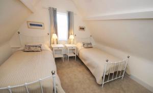 Postelja oz. postelje v sobi nastanitve Quay Corner, 5 bed house, Christchurch Dorset