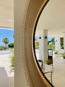 a large mirror on a wall in a room at Casa Bodhi Boutique Hotel & Spa in Marbella