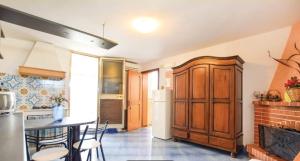 a kitchen with a table and some chairs in it at camera azzurra San Vito Lo Capo in San Vito lo Capo +21 photos