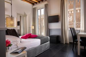 Postel nebo postele na pokoji v ubytování Stay Inn Rome Via Del Corso