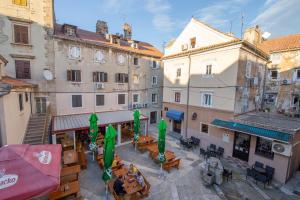 an overhead view of a city with buildings and tables at Apartment Seka Oldtown in Senj
