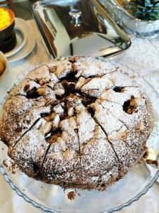 a cake sitting on a plate on a table at B&B Casazze Dream in Marcaria