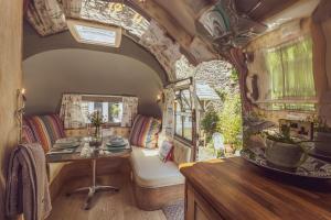 A seating area at Dixie Airstream - Retro 1970s American Airstream close to Windermere