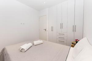 Posteľ alebo postele v izbe v ubytovaní Anius Apartments