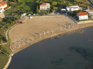 an aerial view of a beach with a group of boats at Apartments Boric in Lopar