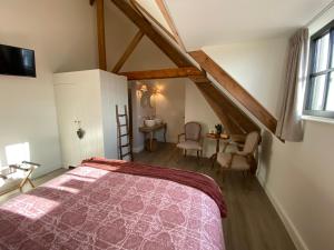 Postel nebo postele na pokoji v ubytování Madelette B&B