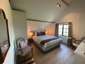 Postel nebo postele na pokoji v ubytování Madelette B&B