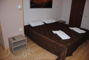 Een bed of bedden in een kamer bij Hotel One Way